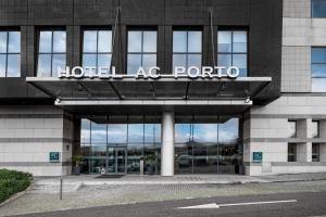 a building with a sign on the side of it at AC Hotel Porto by Marriott in Porto