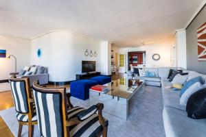 a living room with a couch and a table at LA CONCHA BEACHVIEW apartment in San Sebastián