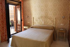 Postel nebo postele na pokoji v ubytování Hotel Manzanito