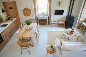 a living room with a table and a couch at La casita de Canido in Oya