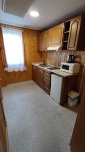 Kuchyň nebo kuchyňský kout v ubytování Penzion apartmány Aninka