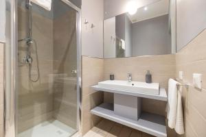 a bathroom with a sink and a shower at Design 18 Charming Rooms in Rome