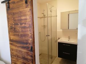 a bathroom with a shower and a sink at Ferienwohnung Jahnel in Waging am See