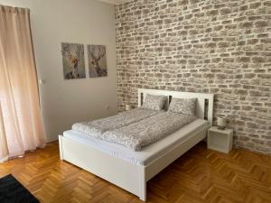 Postel nebo postele na pokoji v ubytování Apartman Sunny