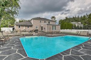 - une piscine en face d'une maison dans l'établissement Jersey Home with Private In-Ground Pool and Hot Tub!, 