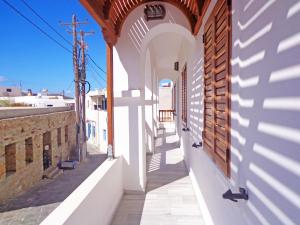 a street in the town of antipolisolisolisolisolisolisolisolisolis at The Windmill in Ios Chora
