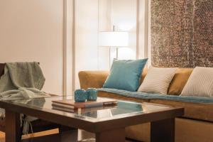 a living room with a couch and a coffee table at San Telmo Suites in Buenos Aires