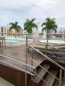 a view of the rooftop of a building with palm trees at Apart hotel- FLAT no melhor do Manaíra Apto 401 in João Pessoa