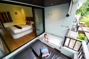 Ein Bett oder Betten in einem Zimmer der Unterkunft Mimosa Resort & Spa