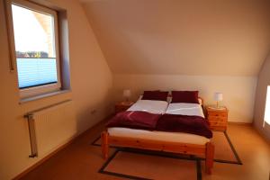 Tempat tidur dalam kamar di FeWo Osterzuschlag