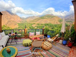 a balcony with a view of a mountain range at Atlas Prestige in Imlil +124 photos