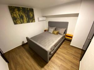 a bedroom with a bed with a laptop on it at Hotel Olé in Monterrey