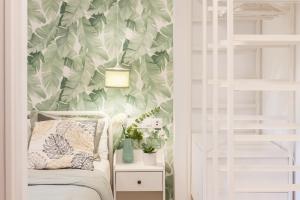 Łóżko lub łóżka w pokoju w obiekcie Madrid Comfort Suites