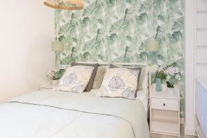 Łóżko lub łóżka w pokoju w obiekcie Madrid Comfort Suites