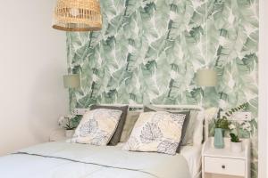 Łóżko lub łóżka w pokoju w obiekcie Madrid Comfort Suites