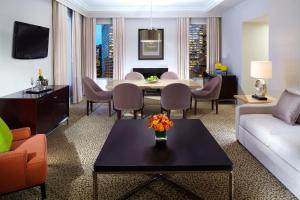 a living room with a couch and a table at Omni Berkshire Place in New York