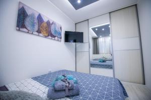 Rúm í herbergi á Apartman Nina II