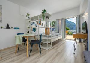a living room with a table and a crib at Casa Belvedere in Rovio