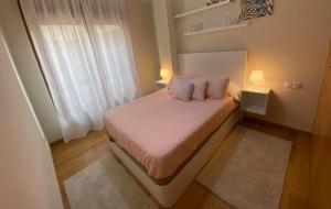 Posteľ alebo postele v izbe v ubytovaní Apartamento Centro Ciudad Pontevedra