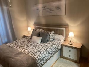 Posteľ alebo postele v izbe v ubytovaní Apartamento Centro Ciudad Pontevedra
