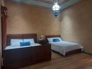 Postel nebo postele na pokoji v ubytování Hotel Ines Maria