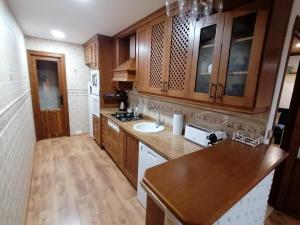 A kitchen or kitchenette at Spacious Apartment