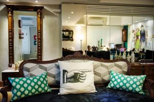 a couch with pillows on it in a store at Porto Retrô Residence in Porto Alegre