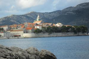 a town on the shore of a body of water at Apartments Blue House in Korčula
