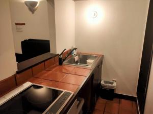 a small bathroom with a sink and a counter at Kunigami-gun - Hotel / Vacation STAY 11195 in Onna