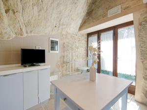 A television and/or entertainment centre at Apartment in Petrella Guidi with Medieval Charm