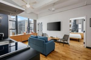 Televisor o centre d'entreteniment de Placemakr Wall Street