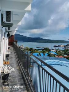 a balcony with a view of a swimming pool at Island Cliff in Port Blair