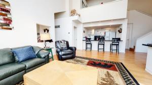 a living room with a couch and a table at Snowcreek #840 condo in Mammoth Lakes