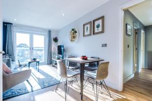 a living room with a table and chairs at Style and Comfort with Private FREE Parking, Sheffield in Sheffield