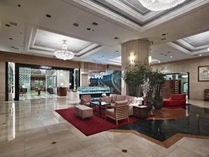 a lobby of a hotel with couches and chairs at Hotel Samjung in Seoul