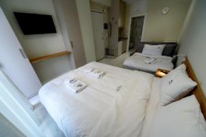 Ένα ή περισσότερα κρεβάτια σε δωμάτιο στο OLIVE 303