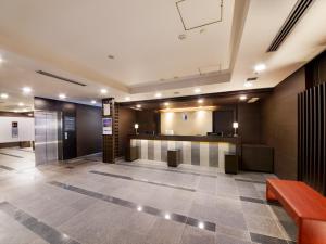 a lobby with a waiting area in a building at Best Western Hotel Fino Osaka Shinsaibashi in Osaka