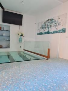 a glass table in a room with a glass floor at Ca'Turino in Vietri sul Mare