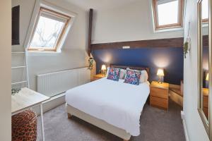 Säng eller sängar i ett rum på Acorn Lodge Harrogate
