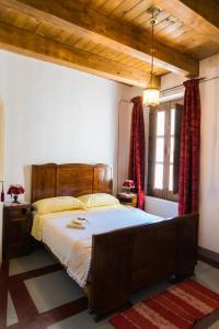 a bedroom with a large bed and a window at Casa Lanzara in Morano Calabro