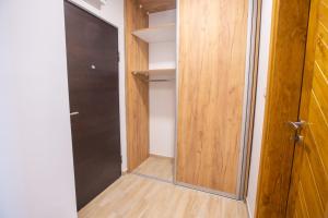 a walk in closet with a glass door at Petar - Jahorinski IZLOG in Jahorina