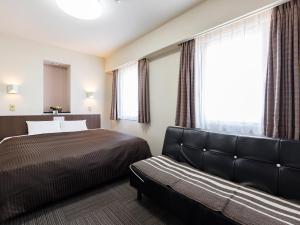 Krevet ili kreveti u jedinici u okviru objekta Hotel Wing International Izumi
