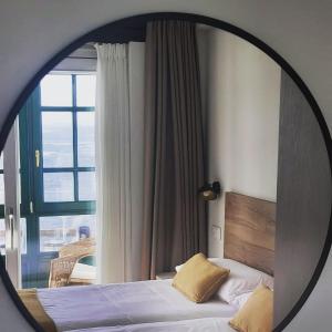 Postel nebo postele na pokoji v ubytování Apartamentos El Muelle Comillas