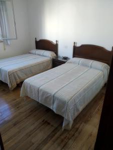 Postel nebo postele na pokoji v ubytování HOSTAL RESIDENCIA PRESIDENTE