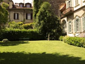 a park bench in front of a large building at Casine Calasole in Turin