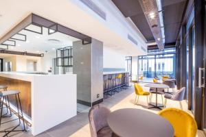 an office with tables and chairs and a bar at #AlimamaSpaces The Foreshore Haven in Cape Town