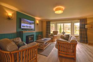 TV a/nebo společenská místnost v ubytování Glen Nevis Holidays