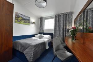 מיטה או מיטות בחדר ב-Hotel AGAT