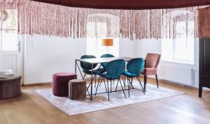 a dining room with a table and chairs at WINEHOUSE Living in Leutschach
