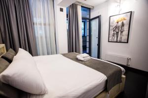 Voodi või voodid majutusasutuse The Phoenix Boutique Hotel toas